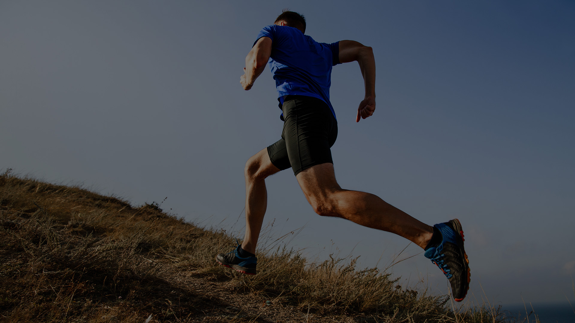 middle aged pain free man running in field